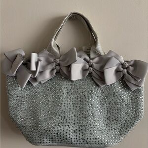 Sequined bow embellished handbag